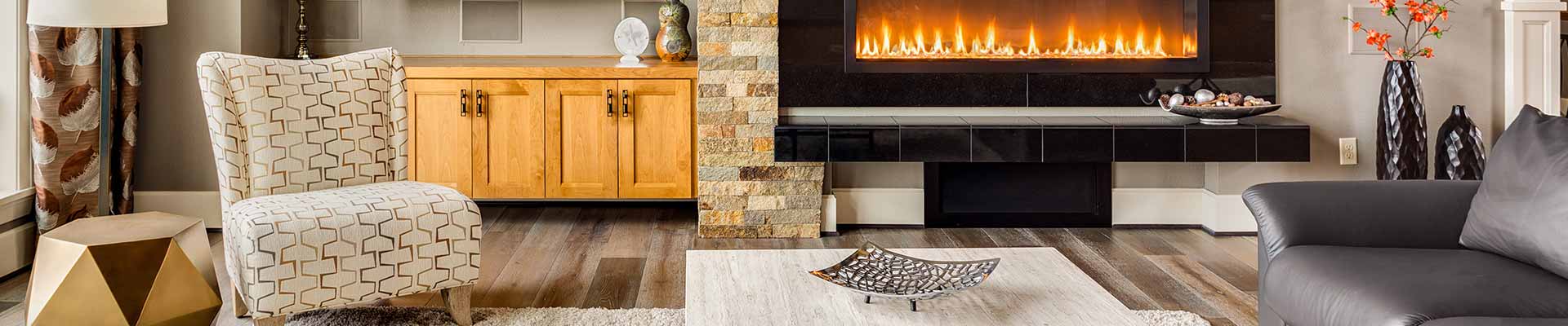 living room with stone fireplace